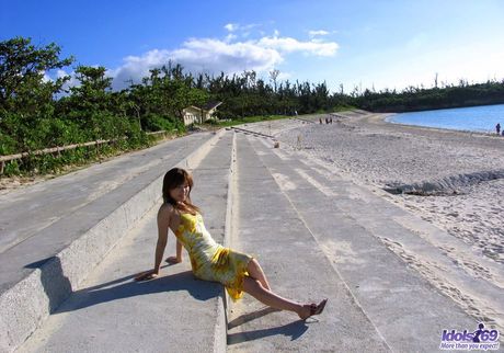 Sexy Japanese mom Yua Aida strips and displays her sexy booty on the beach