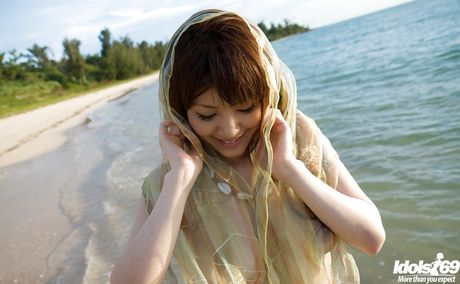 Delightful japanese babe Mari Misaki showing big boobs and hairy pussy on the beach